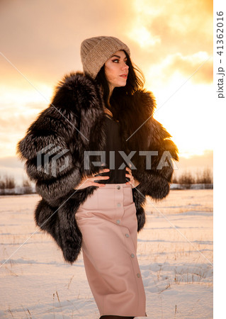Girl at the background of a sunset 41362016