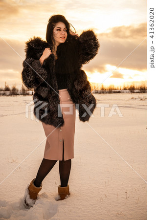 Woman in a winter forest 41362020