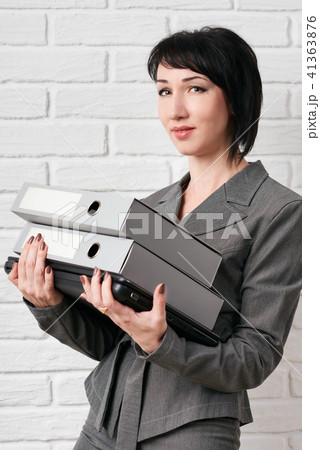 business woman stay in front of a white wall business woman stay in front of a white wall 41363876