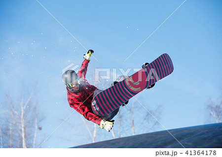 Picture of young athlete jumping with snowboard 41364178