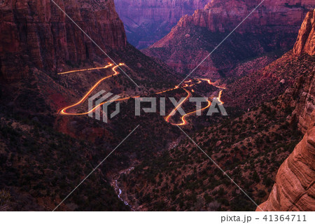 Road in Zion National Park with car light trails Road in Zion National Park with car light trails 41364711
