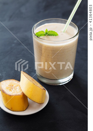 Banana smoothie with mint on dark background 41364803