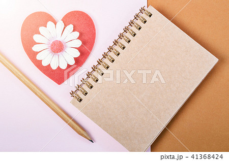 Blank diary and red heart with wooden pen. 41368424