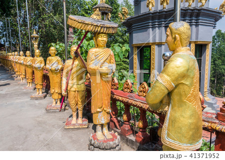 statues surrounding temple of wat kraom. Cambodia statues surrounding temple of wat kraom. Cambodia 41371952