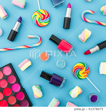 Composition with cosmetics and bright candy 41378075