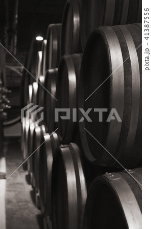 Wooden barrels in dark winery, close up Wooden barrels in dark winery, close up 41387556
