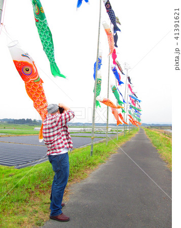 Man taking photo of Koinobori or carp-shaped flags Man taking photo of Koinobori or carp-shaped flags 41391621