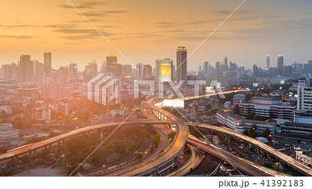 Highway intersection with city business downtown Highway intersection with city business downtown 41392183