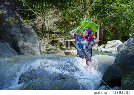 Beautiful Asian woman with thai traditional dress Beautiful Asian woman with thai traditional dress 41392286