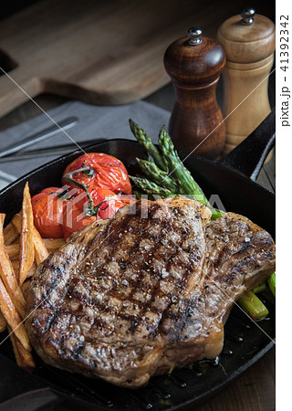 grilled rib eye steak on pan grilled rib eye steak on pan 41392342