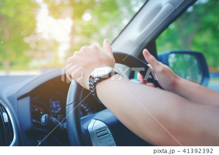 Closeup hand wear smart of Man driving a car Closeup hand wear smart of Man driving a car 41392392