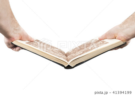 Hands hold an open book 41394199