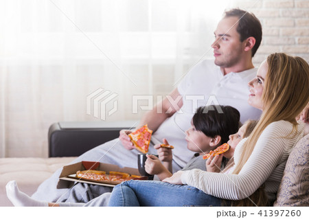 Family watching TV Family watching TV 41397260