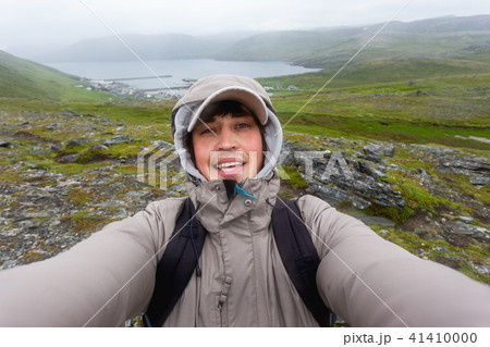Man making selfie on hill near Skarsvag. Norway 41410000