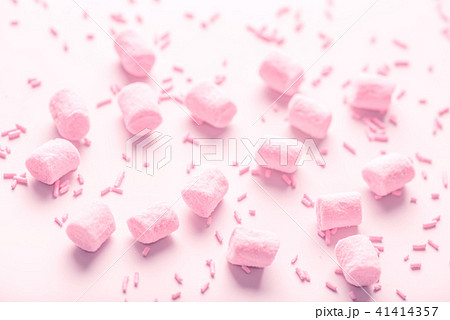 marshmallows and sprinkles, soft pink background marshmallows and sprinkles, soft pink background 41414357