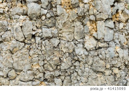 Textured stone background Rubble ballast in natural form in the rock wall 41415093