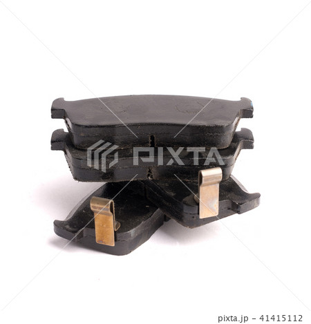 Set of 4 pieces of new front disc brake pads, isolated on white Set of 4 pieces of new front disc brake pads, isolated on white 41415112