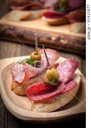 Tapas with sliced sausage, salami, olives 41415677