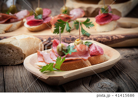 Tapas with sliced sausage, salami, olives 41415686