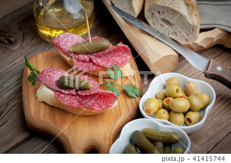 Tapas with sliced sausage, salami, olives 41415744