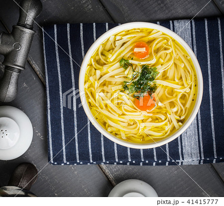 Tasty meat broth with noodles. 41415777