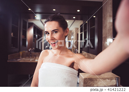Happy girl making selfie in bathroom 41421222
