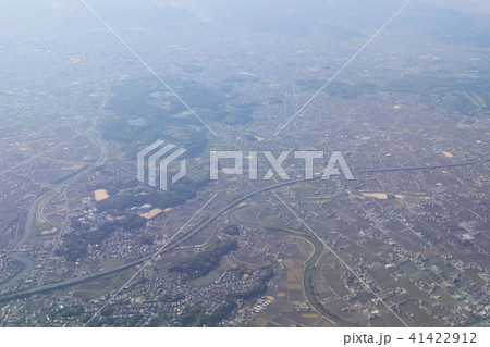 Aerial view of plane window looking down japan Aerial view of plane window looking down japan 41422912
