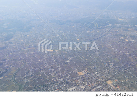 Aerial view of plane window looking down japan Aerial view of plane window looking down japan 41422913