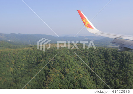 Aerial view of plane window looking down of land Aerial view of plane window looking down of land 41422986