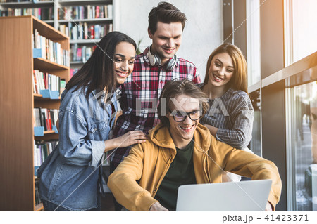 Positive men and girls using gadget Positive men and girls using gadget 41423371