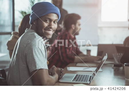 Pleasant guy is laboring in office Pleasant guy is laboring in office 41424206