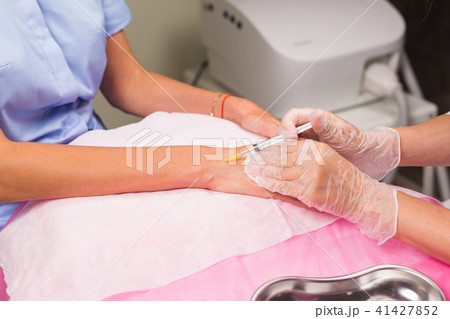 cosmetology and beauty concept - Anti-age injection therapy, hand rejuvenation 41427852