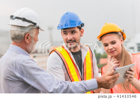 Engineer Teamwork consult together looking 41433546