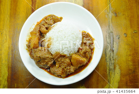 pork curry and potato with rice on plate 41435664