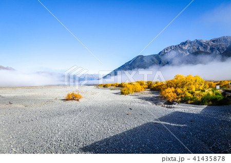 Fog on plain in New Zealand mountains 41435878