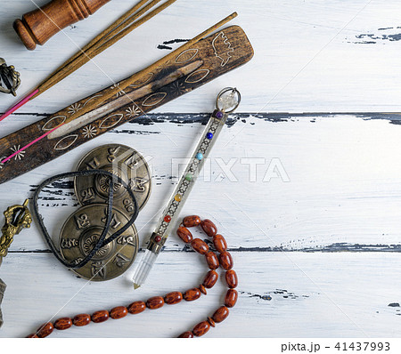 stone rosary and incense sticks 41437993