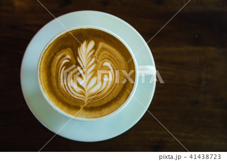 top view of Coffee cup with latte art on wooden  41438723