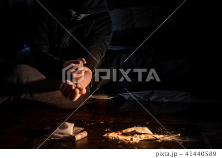 Junkie man injecting heroin dose. Drug addiction 41440589