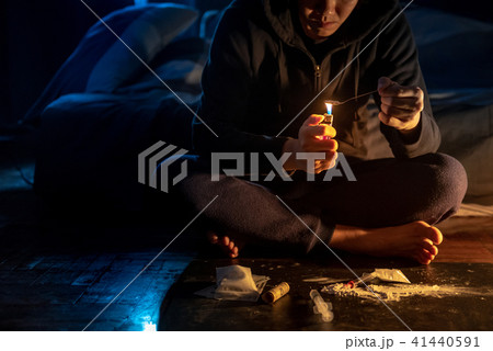 Junkie man preparing heroin dose. Drug addiction Junkie man preparing heroin dose. Drug addiction 41440591