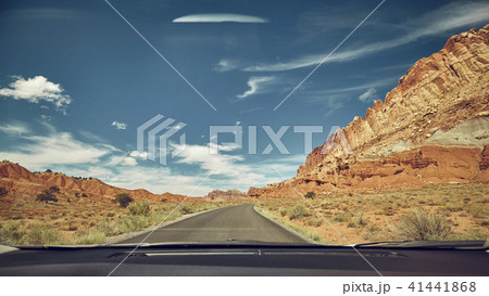 Retro toned road seen through a windshield 41441868