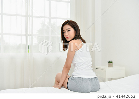 Lifestyle Concept. Beautiful asian woman is relaxing in a white Lifestyle Concept. Beautiful asian woman is relaxing in a white 41442652