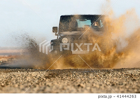 Splashing water with an offroad car Splashing water with an offroad car 41444263