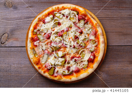 Classical napoli pizza with salami and gherkins Classical napoli pizza with salami and gherkins 41445105