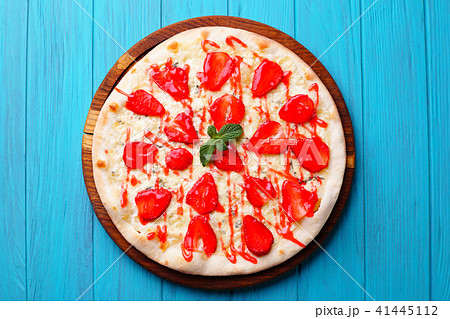seasonal fruit strawberry pizza at blue background seasonal fruit strawberry pizza at blue background 41445112