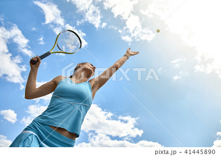 Sportive girl plays tennis 41445890