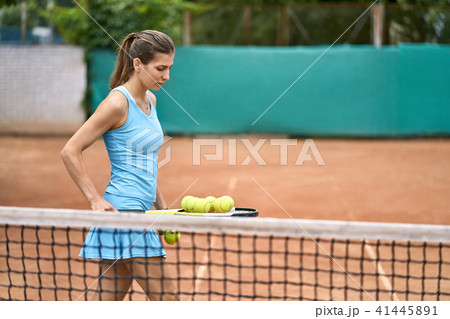 Sportive girl plays tennis 41445891