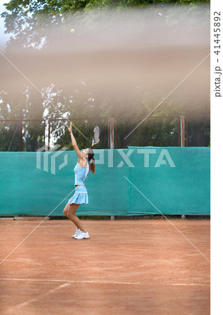 Sportive girl plays tennis Sportive girl plays tennis 41445892