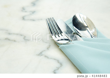 Cutlery Set  a blue napkin on marble 41448483