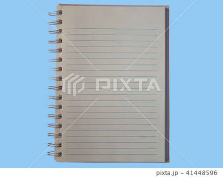 Top view school notebook on a blue background. Top view school notebook on a blue background. 41448596