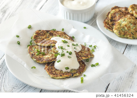 Zucchini fritters with greek yogurt Zucchini fritters with greek yogurt 41456324